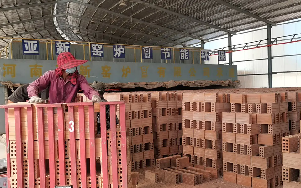 Brick handling at Cambodia Project No. 2 with a 12.98 m mobile tunnel kiln